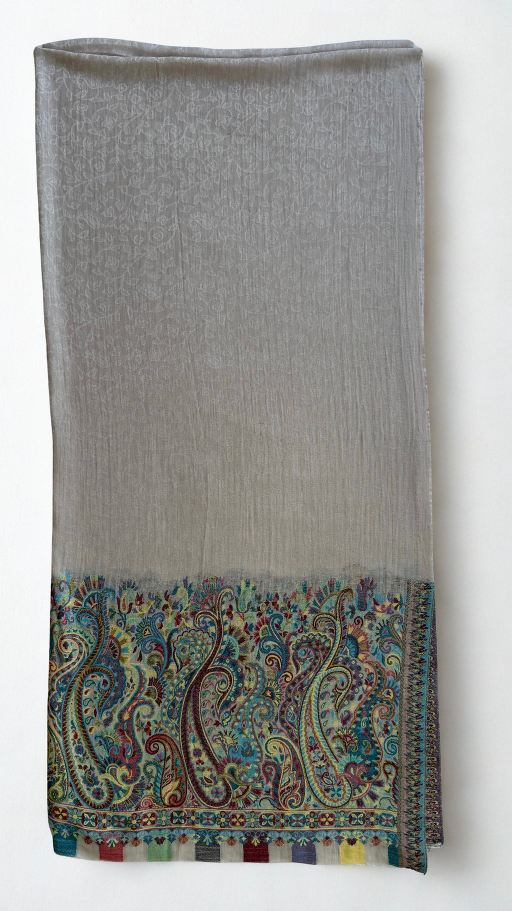 Close view of the tall curving paisleys in turquoise, teal, saffron and claret