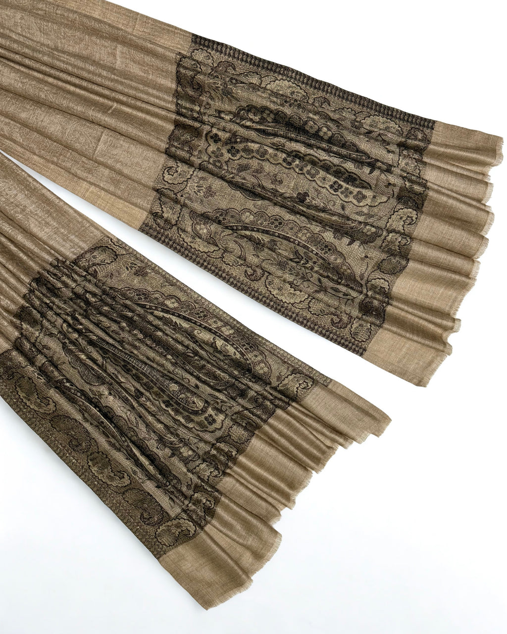 Close-up of both ends of a fawn pashmina ring shawl, showing the black and brown woven paisley pallas