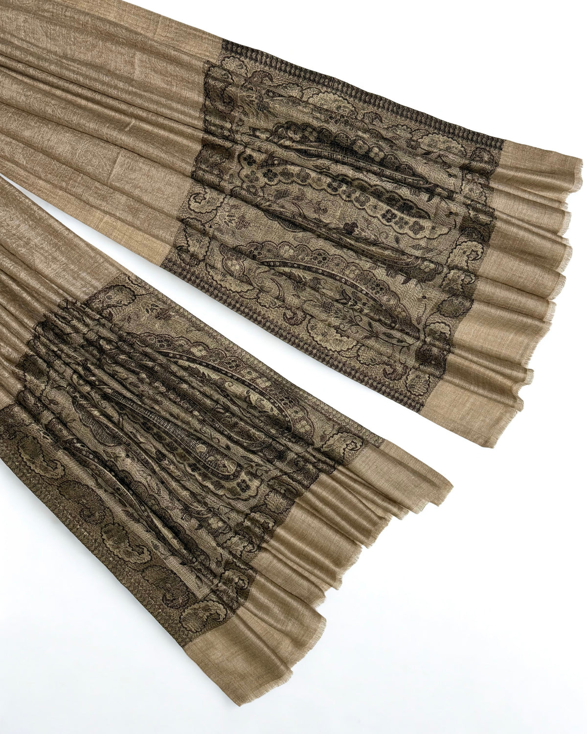 Close-up of both ends of a fawn pashmina ring shawl, showing the black and brown woven paisley pallas