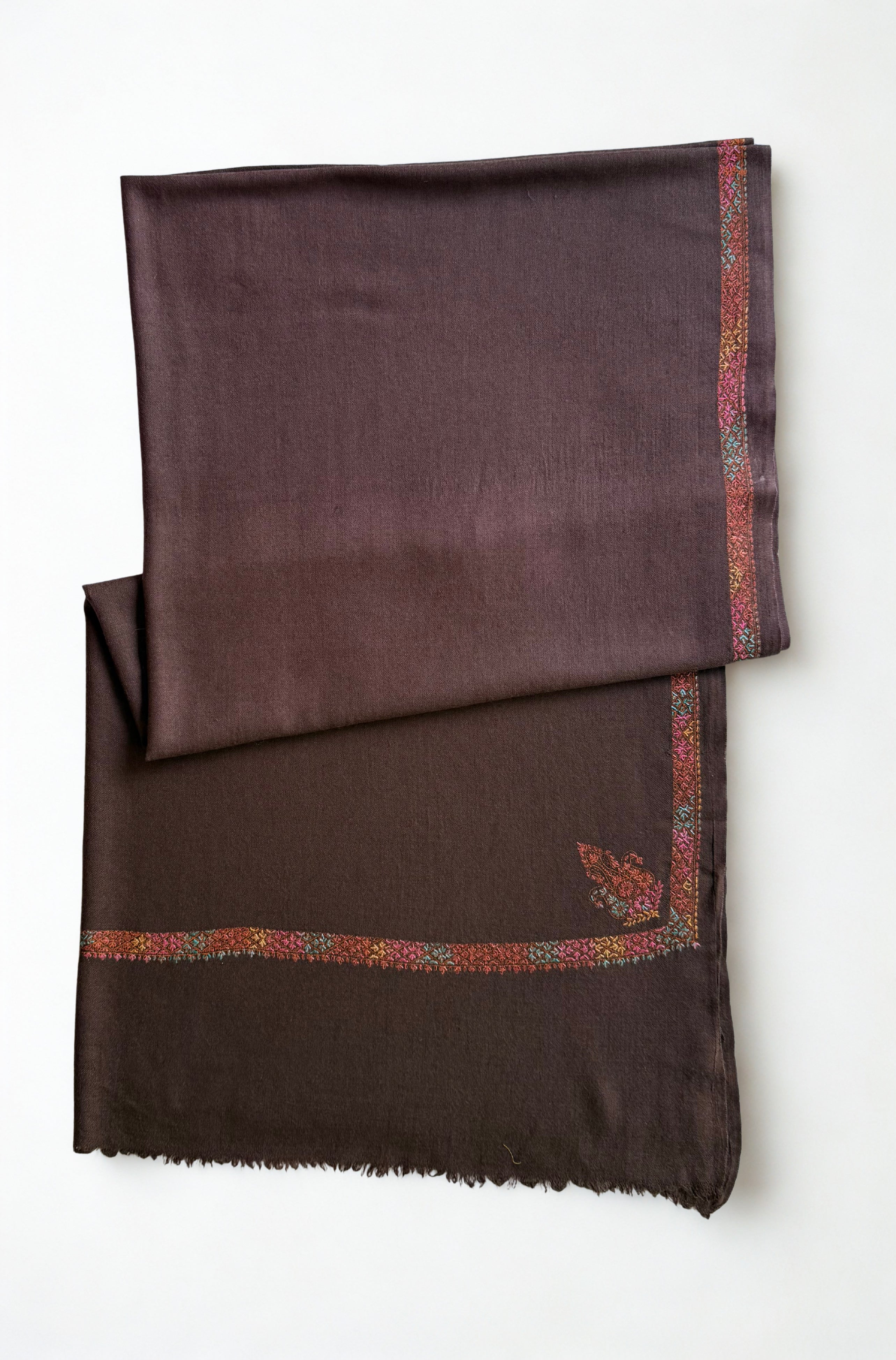 Espresso brown Swati Shahtoosh shawl folded back to show both corner buta and the embroidered border meeting at the corner