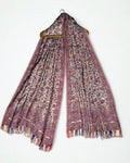 Almond Kani pashmina shawl folded back to show the cornflower blue and rose floral weave and scalloped border