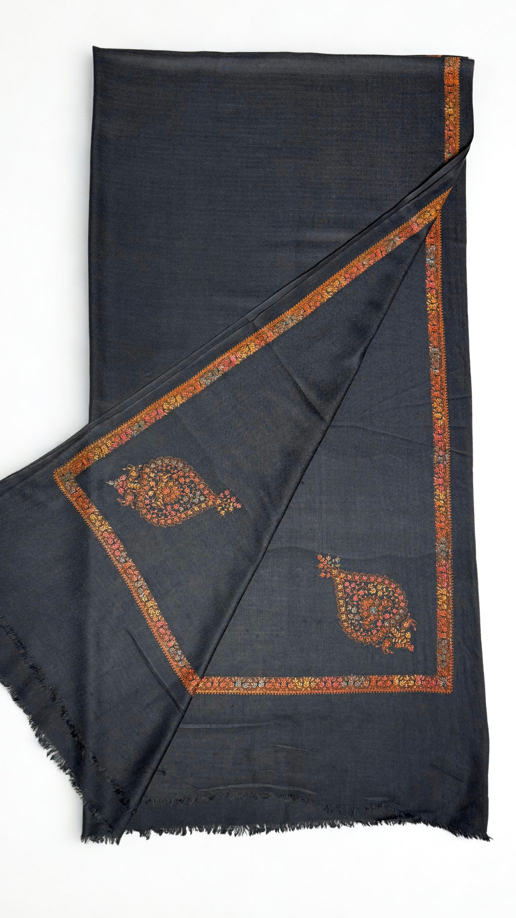 Charcoal grey Swati Shahtoosh shawl laid flat, showing the self-coloured lattice ground and the embroidered border running the edge