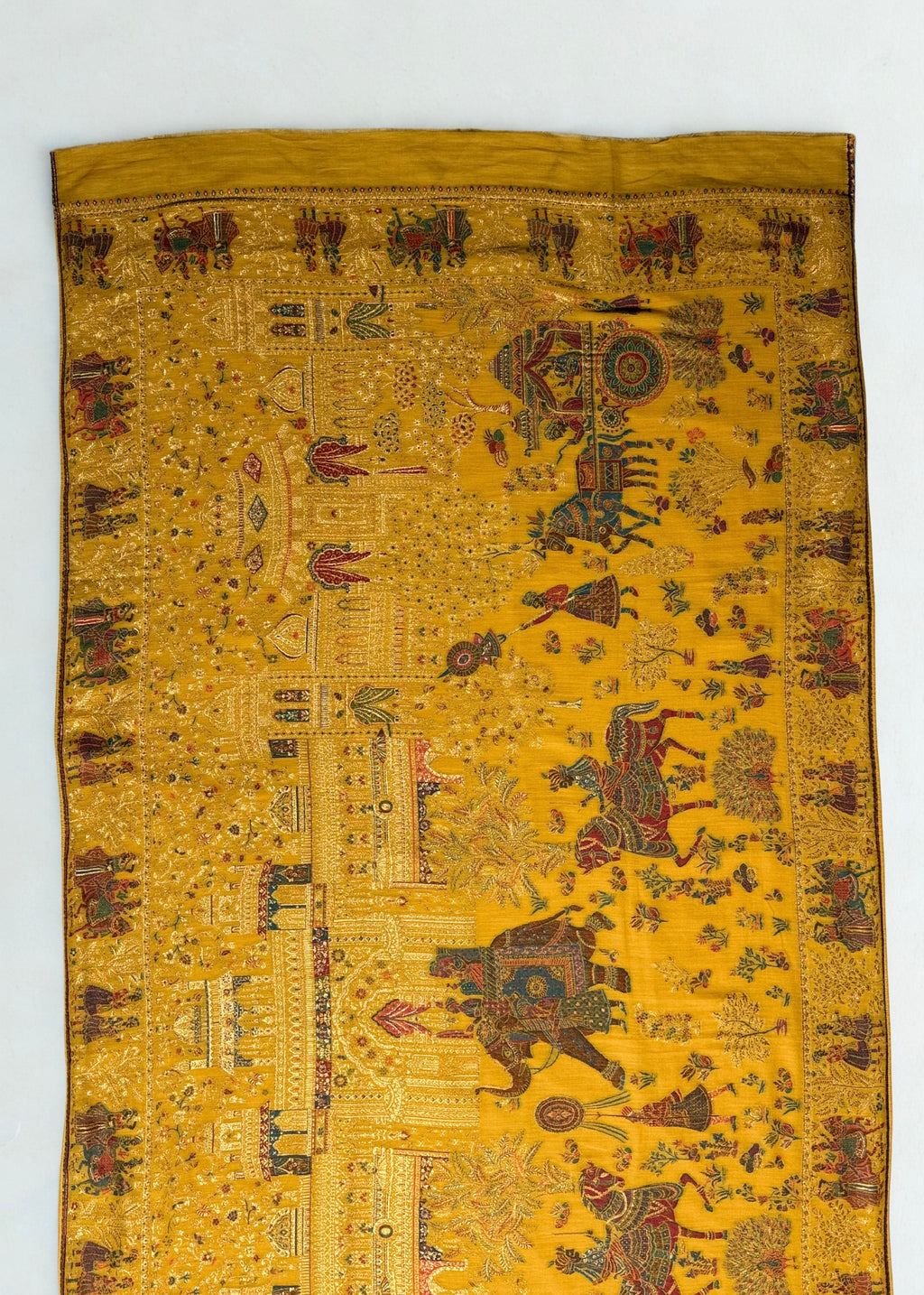 Mustard Mughal court Kani pashmina shawl in soft folds, gold zari elephants, horsemen and pavilions across the field