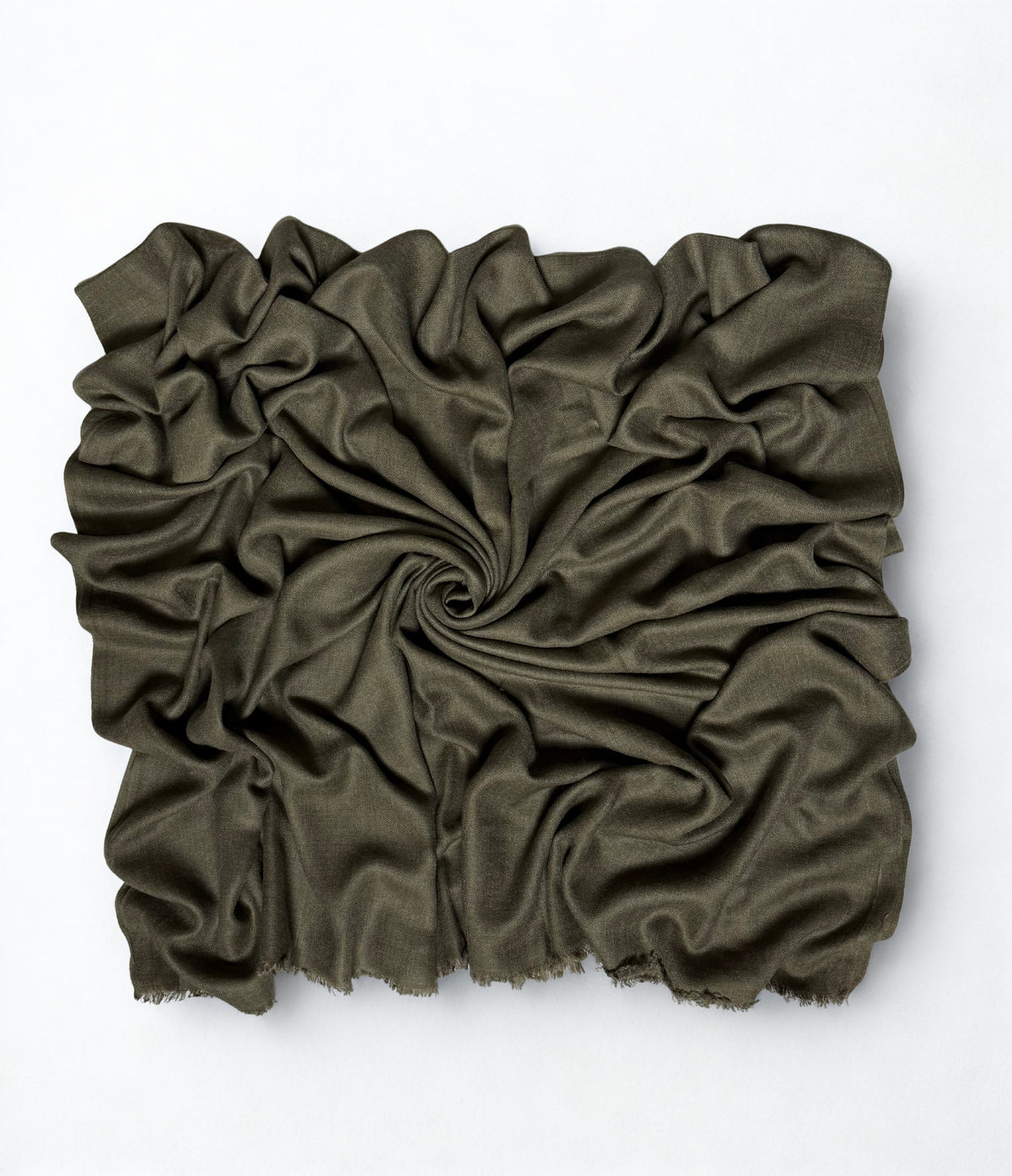 Olive Swati Shahtoosh shawl gathered in a swirl, the matt cloth catching light along the folds
