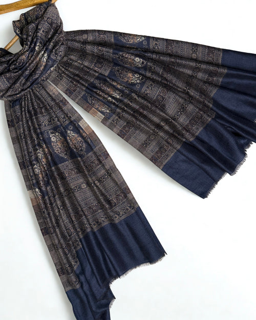 Indigo and bronze Indian pashmina shawl folded to show the banded paisley weave and plain indigo end panels