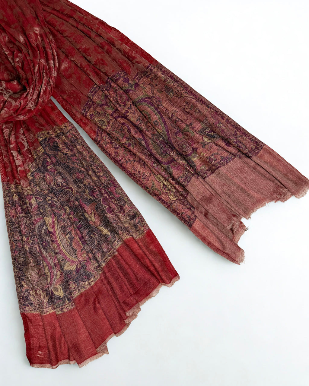 Self-patterned paisley and floral vine woven into the scarlet ground in the same colour
