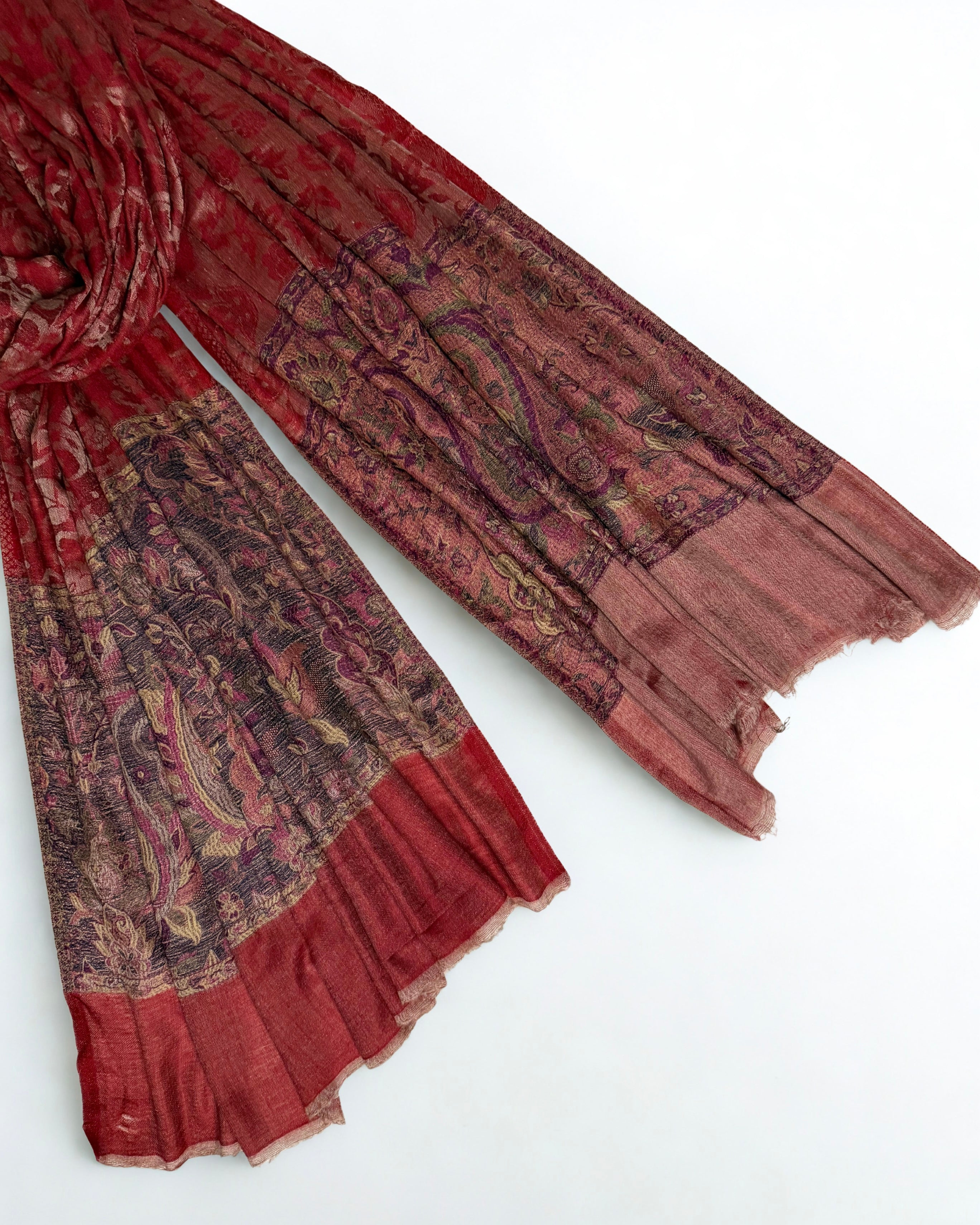 Self-patterned paisley and floral vine woven into the scarlet ground in the same colour