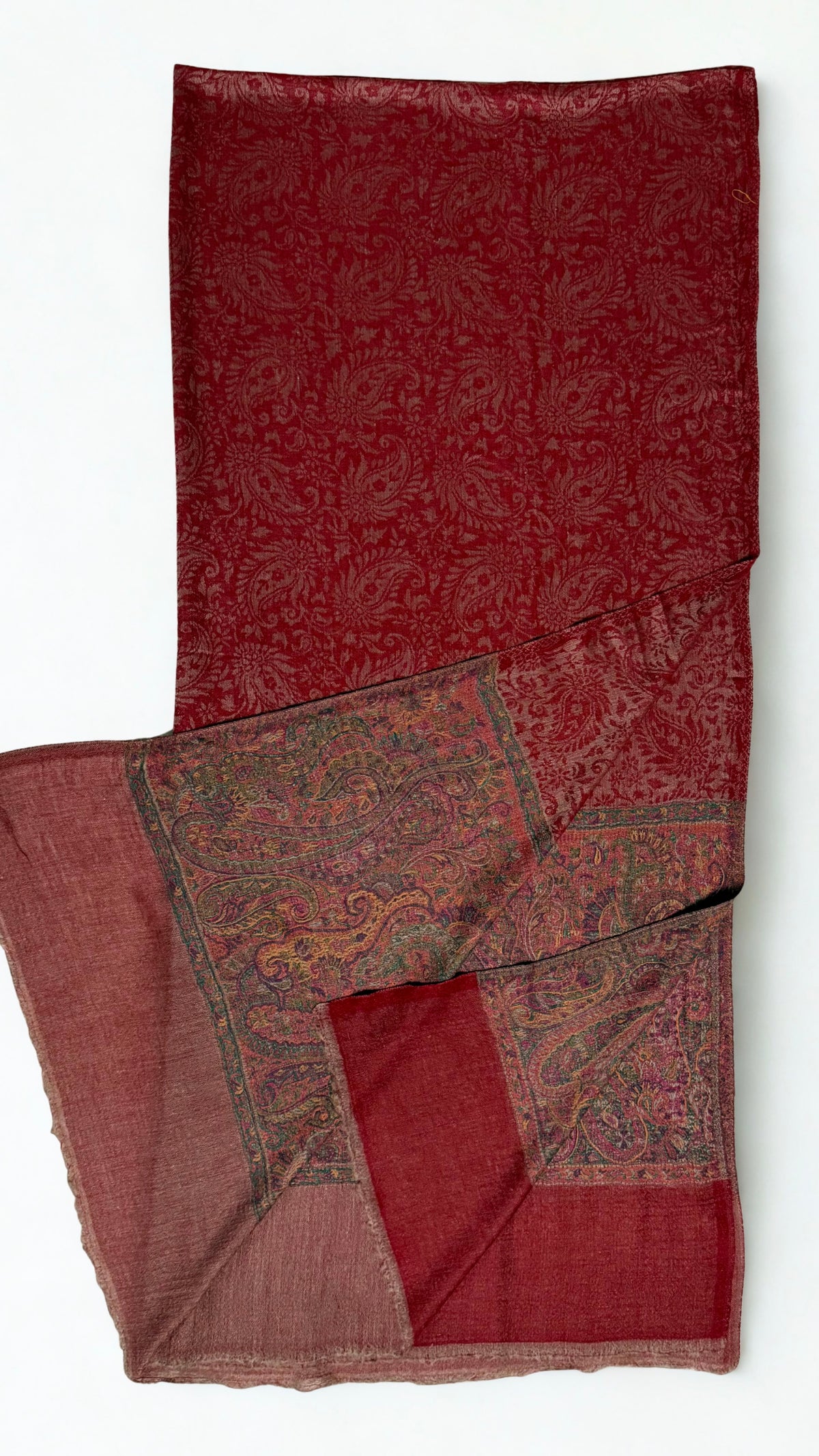 Brick red fine pashmina ring (Palladar) shawl with antique-toned paisley border, shown draped