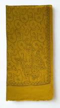 Mustard Swati Shahtoosh shawl folded full length, hand-embroidered paisley vine across the whole field