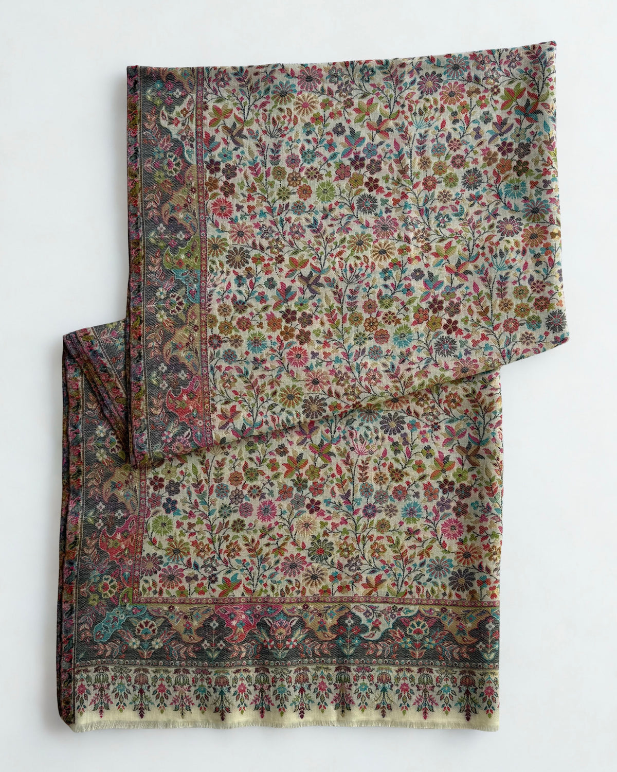 Ivory Zari Kani pashmina shawl laid flat, dense scattered floral field framed by a deep slate border and fringed end band