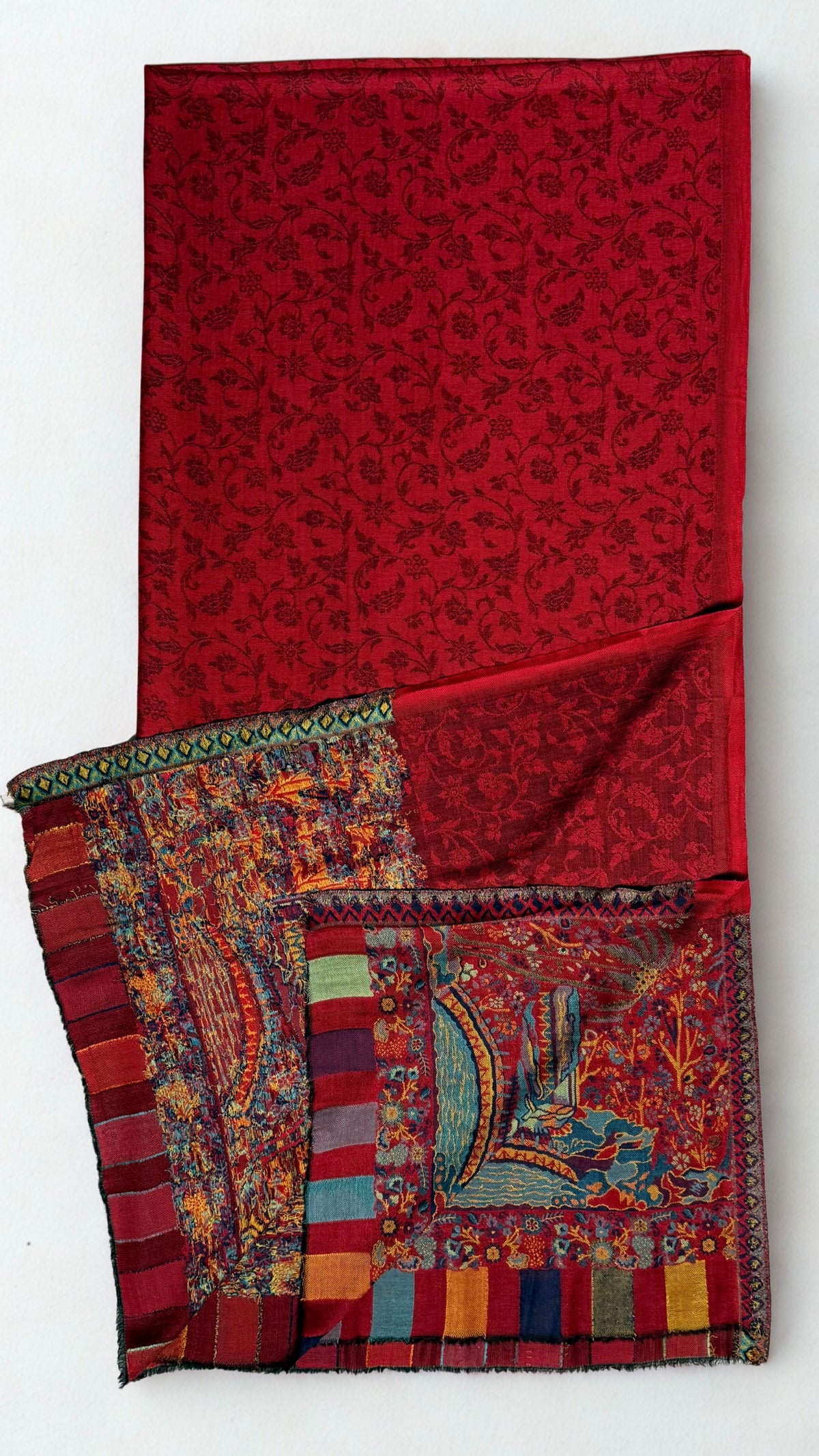 Ruby red fine pashmina ek rukh ring (Palladar) shawl with woven village landscape end panel, shown folded full length