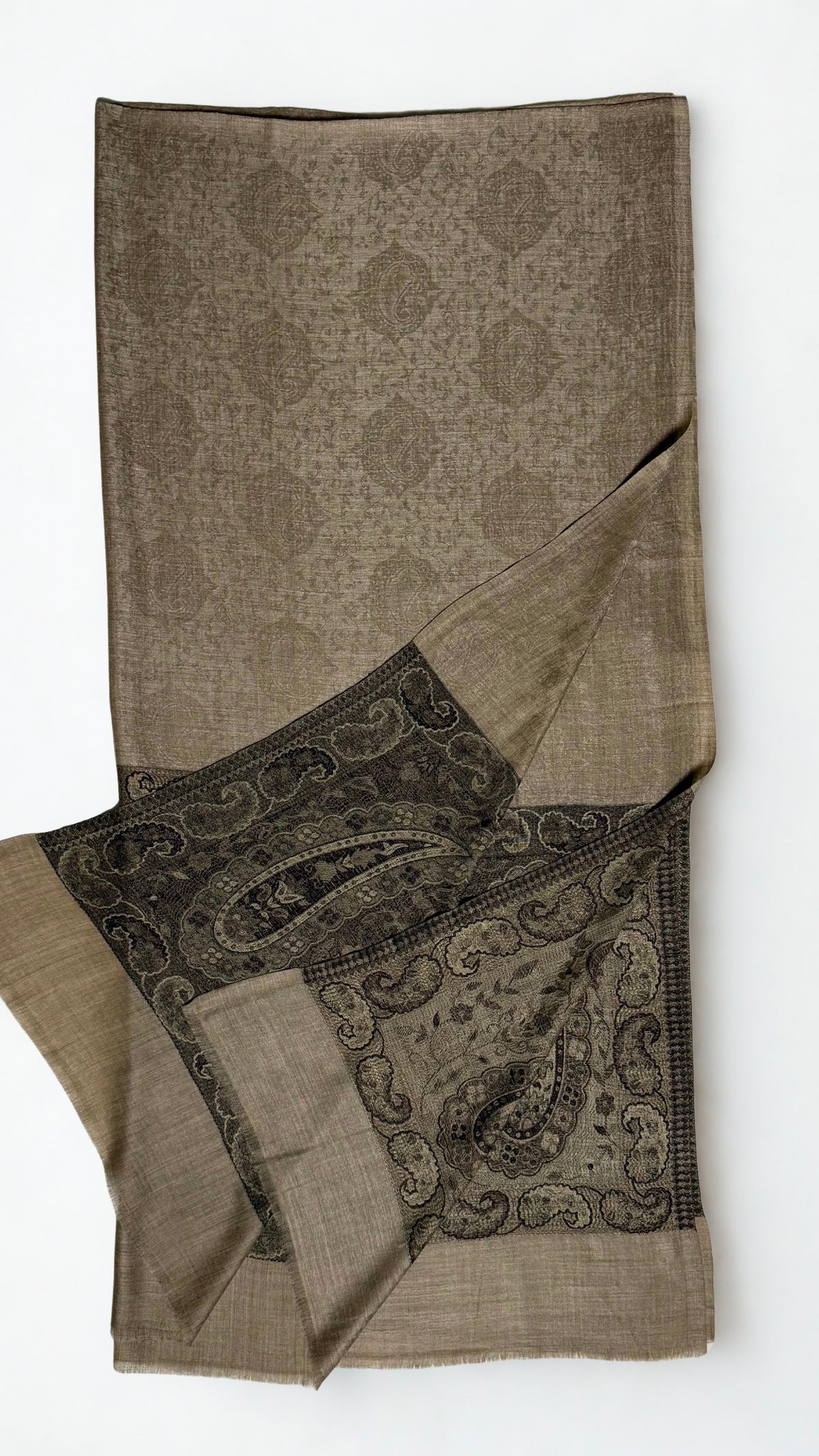 Fawn Palladar shawl folded with one end turned back, showing both black paisley pallas against the pale field
