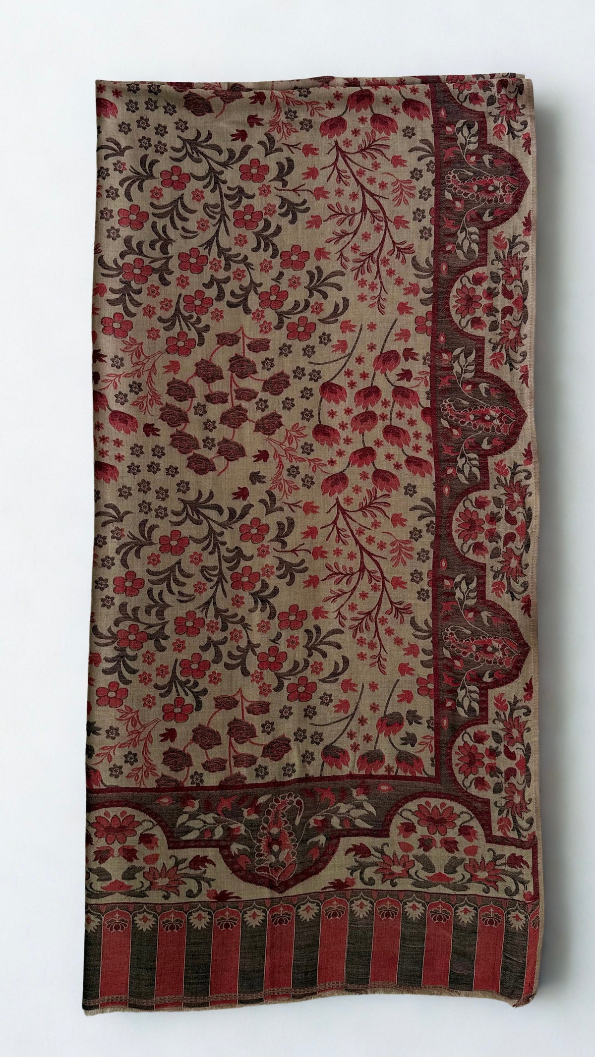 Taupe Kani pashmina shawl laid flat, rosewood flowering sprays framed by a scalloped paisley border with a striped colonnade end panel