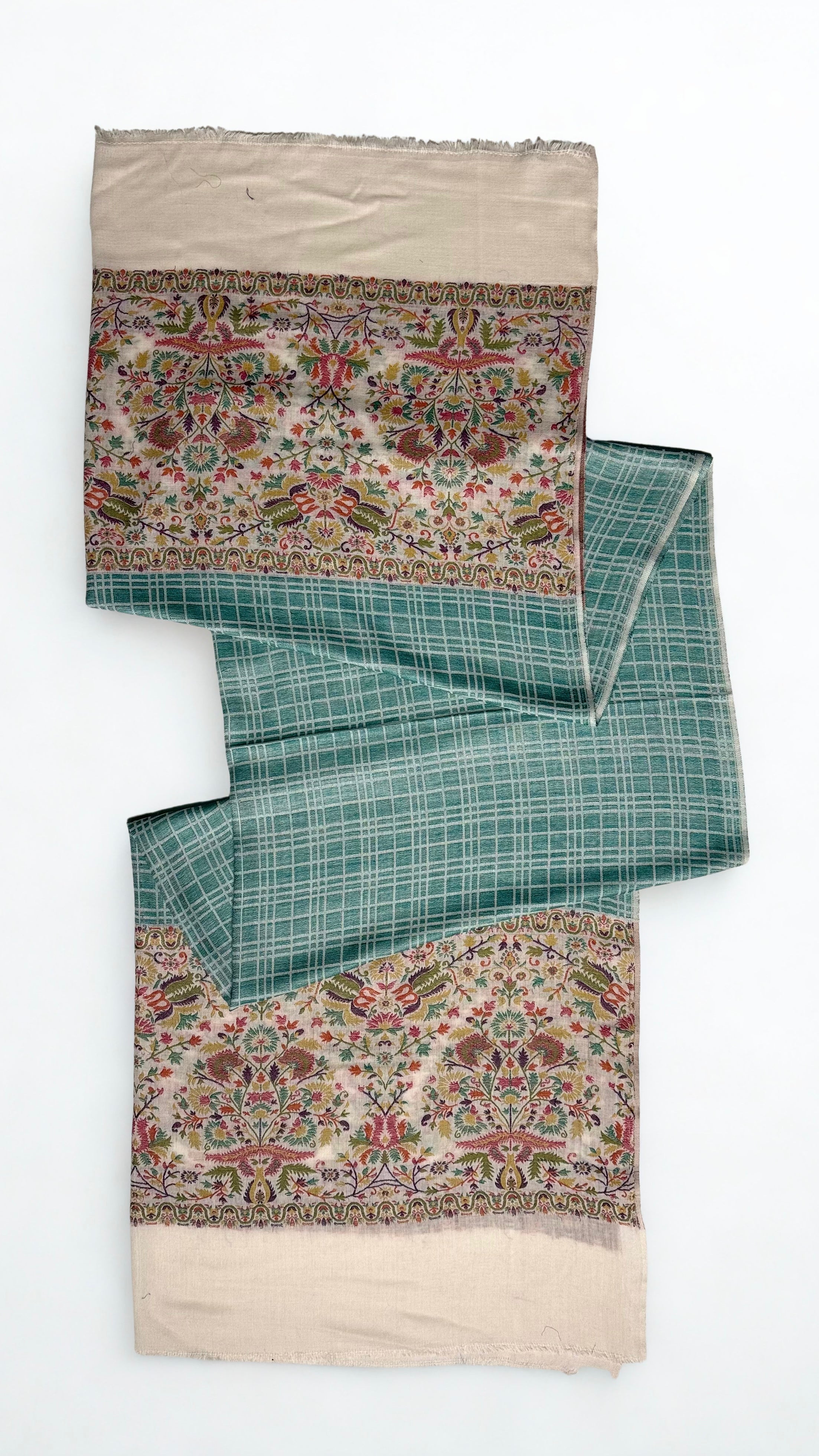 Sea green checked Kani pashmina shawl laid flat, showing the woven check field and deep ivory floral end border