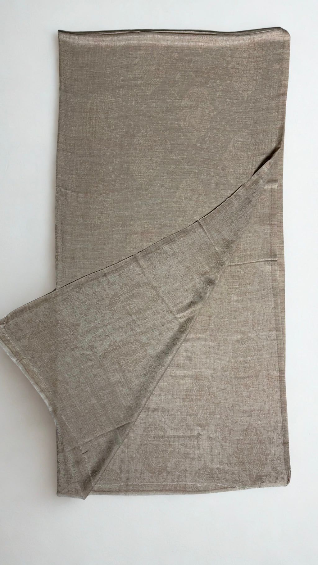 Stone taupe pashmina ring shawl folded with one corner turned back, showing the tone-on-tone woven paisley on both faces