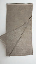 Stone taupe pashmina ring shawl folded with one corner turned back, showing the tone-on-tone woven paisley on both faces