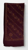 Deep maroon Swati Shahtoosh shawl folded, showing diagonal rows of hand-embroidered paisley and vine, corner medallion, embroidered border and plain fringed end