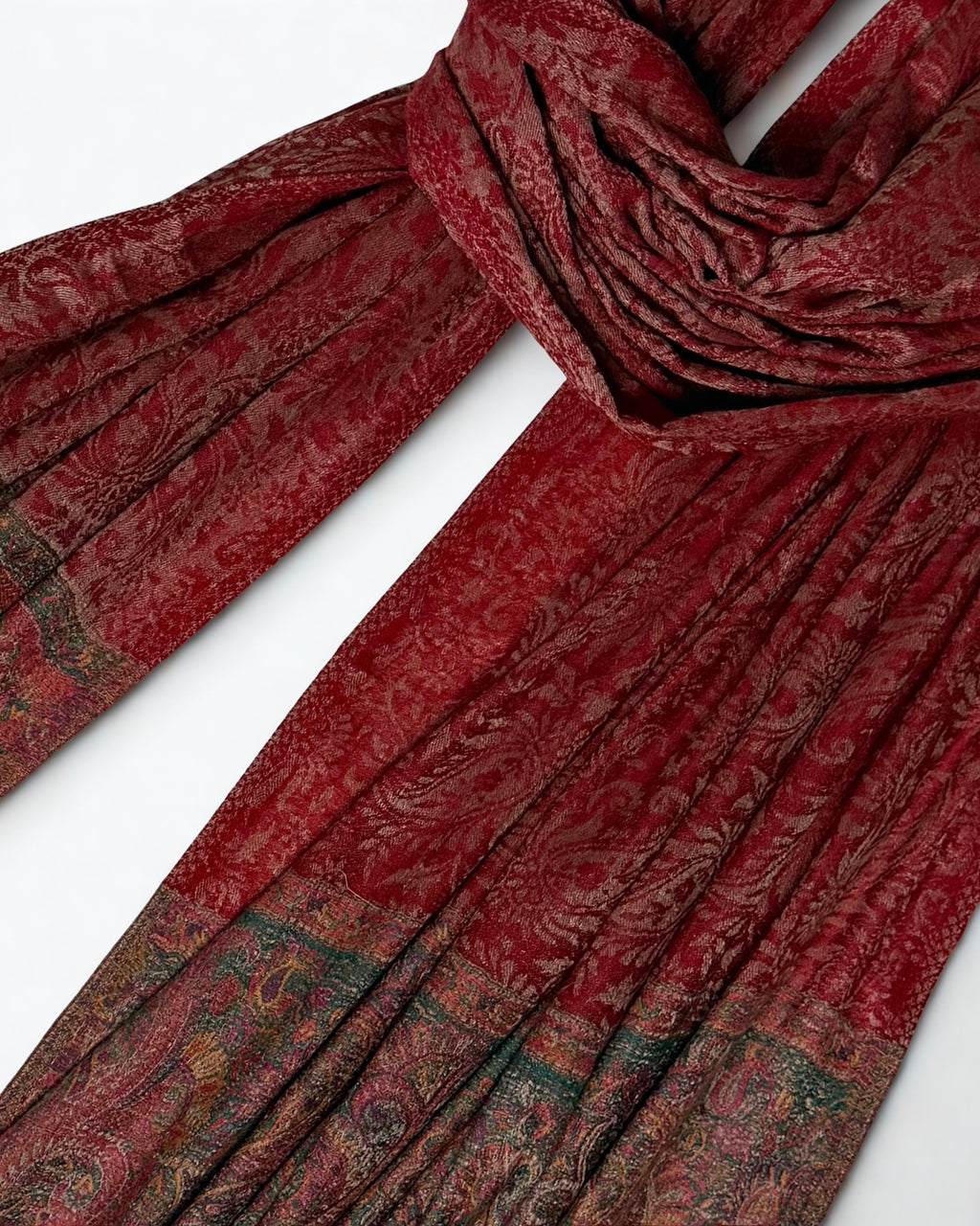 Self-patterned paisley ground of the brick red pashmina shawl, the pattern woven in the same colour