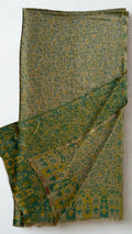 Moss green and ochre Kani pashmina shawl laid flat, fine all-over vine field with a bold arched blossom end panel