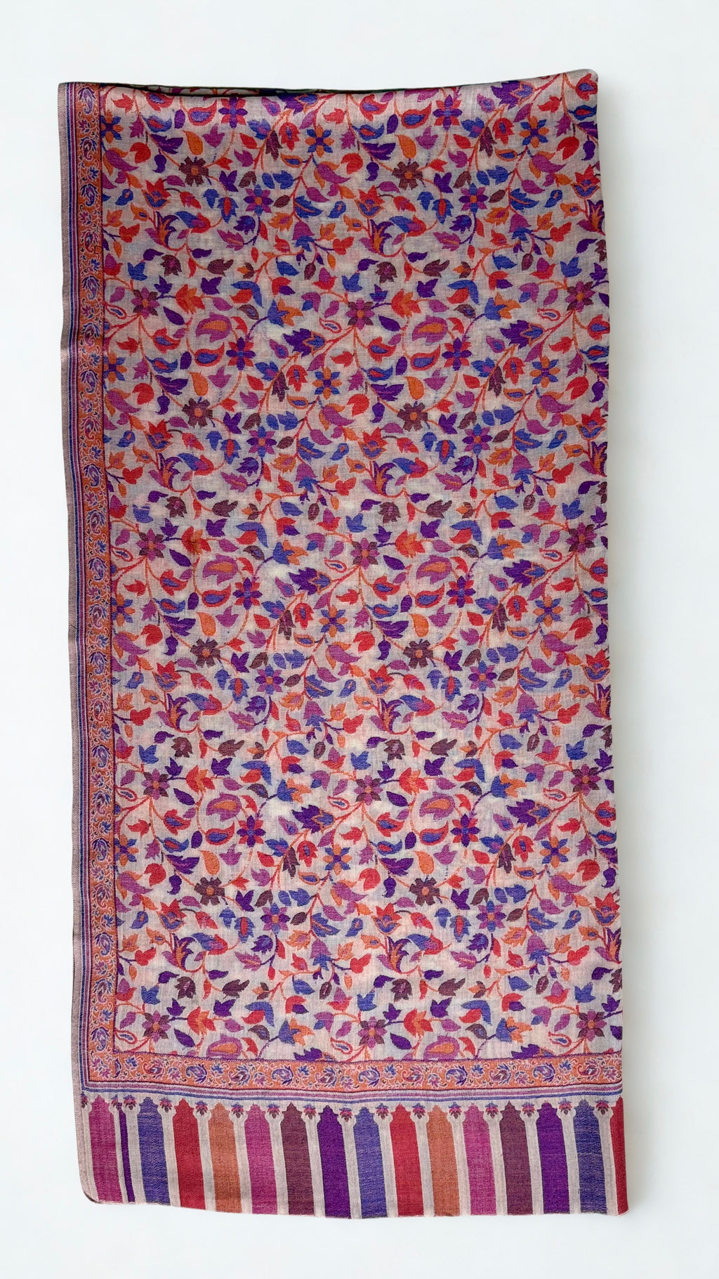 Blush multicolour Kani pashmina shawl folded lengthwise, showing the floral weave and striped border