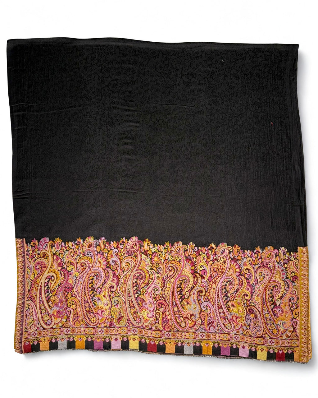Close view of the rose, gold and lilac paisleys woven on one face at the end of a black pashmina ring shawl