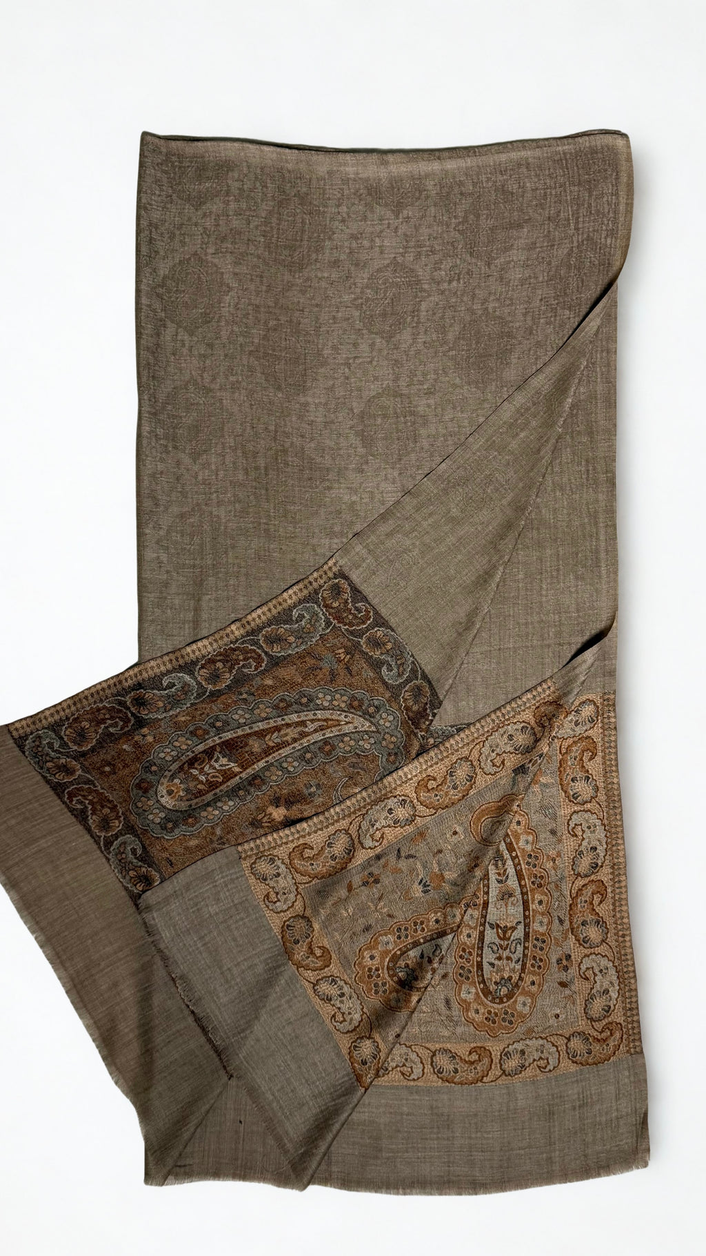 Warm khaki pashmina ring shawl folded with one end turned back, showing the woven medallion field and both paisley pallas in copper and deep brown