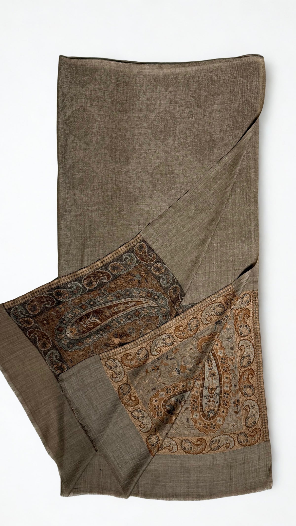 Warm khaki pashmina ring shawl folded with one end turned back, showing the woven medallion field and both paisley pallas in copper and deep brown
