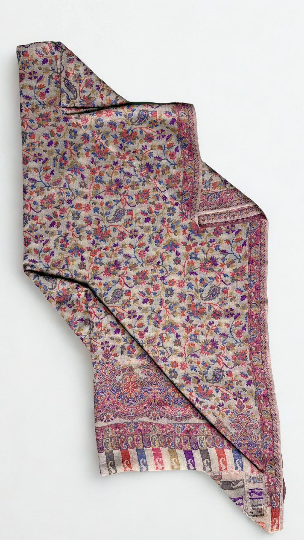 Almond and cornflower Kani pashmina shawl hung on a hanger, showing its full length and drape