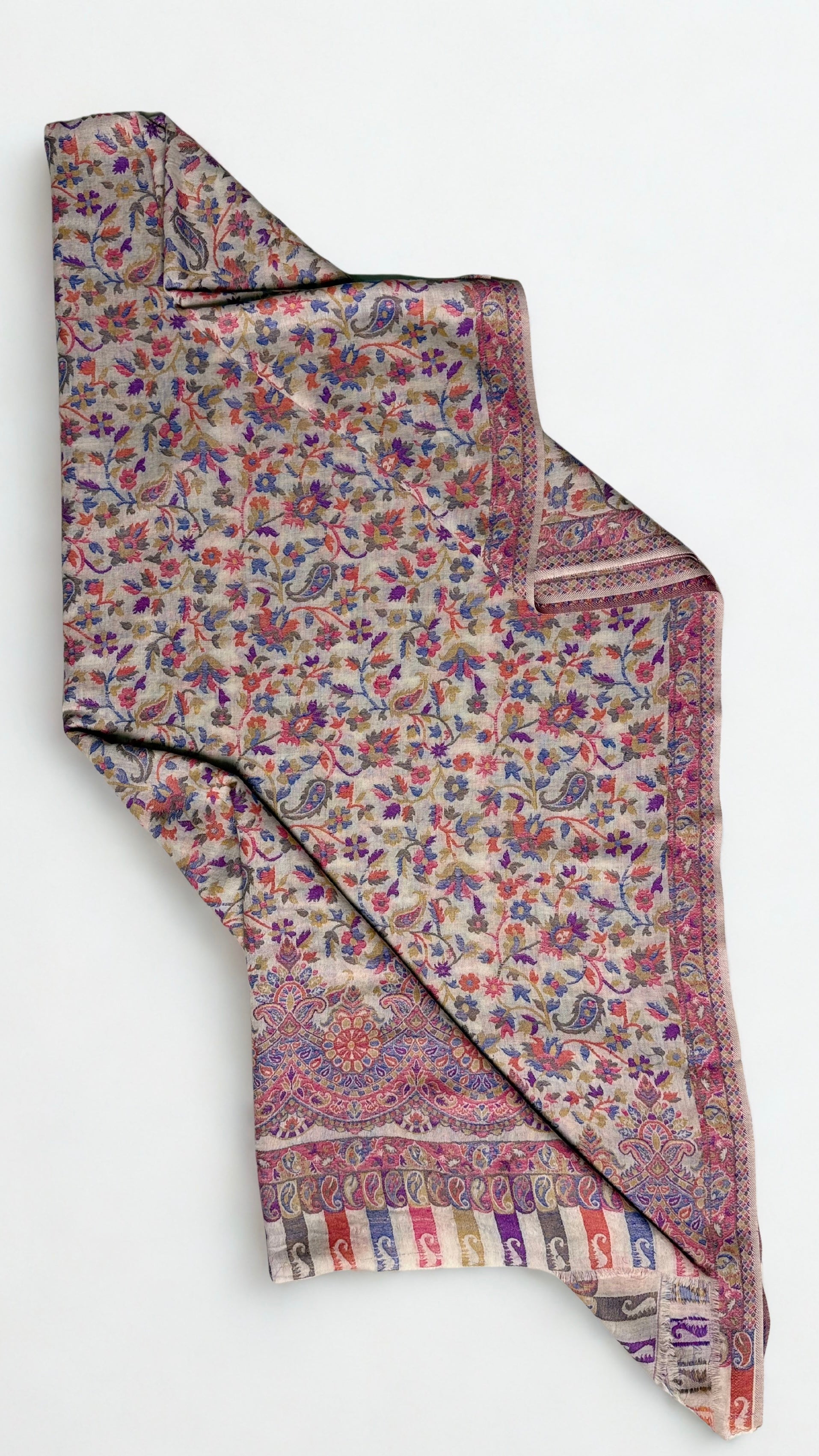 Almond and cornflower Kani pashmina shawl hung on a hanger, showing its full length and drape