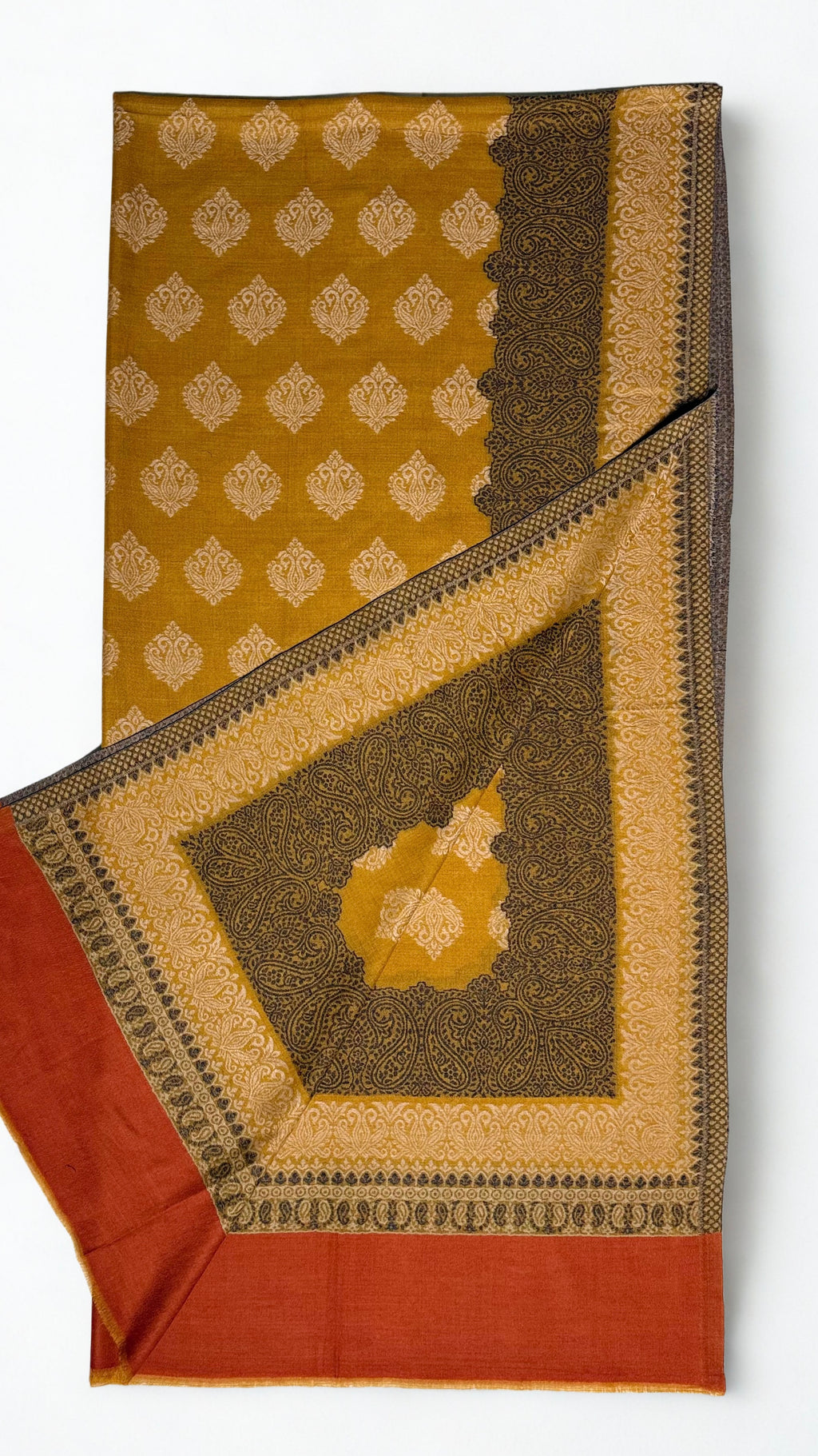 Mustard Kashmiri pashmina Kani border shawl laid flat, cream buta field framed by a broad woven paisley border with a rust end panel