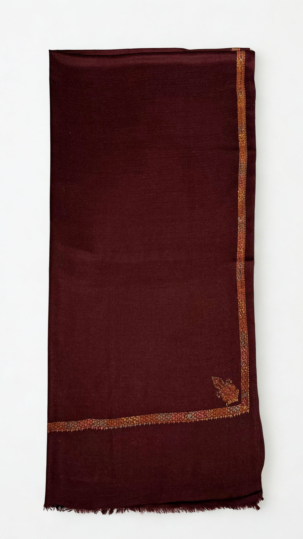 Deep maroon Swati Shahtoosh shawl swirled open, showing the drape and the gold embroidered border on all four sides