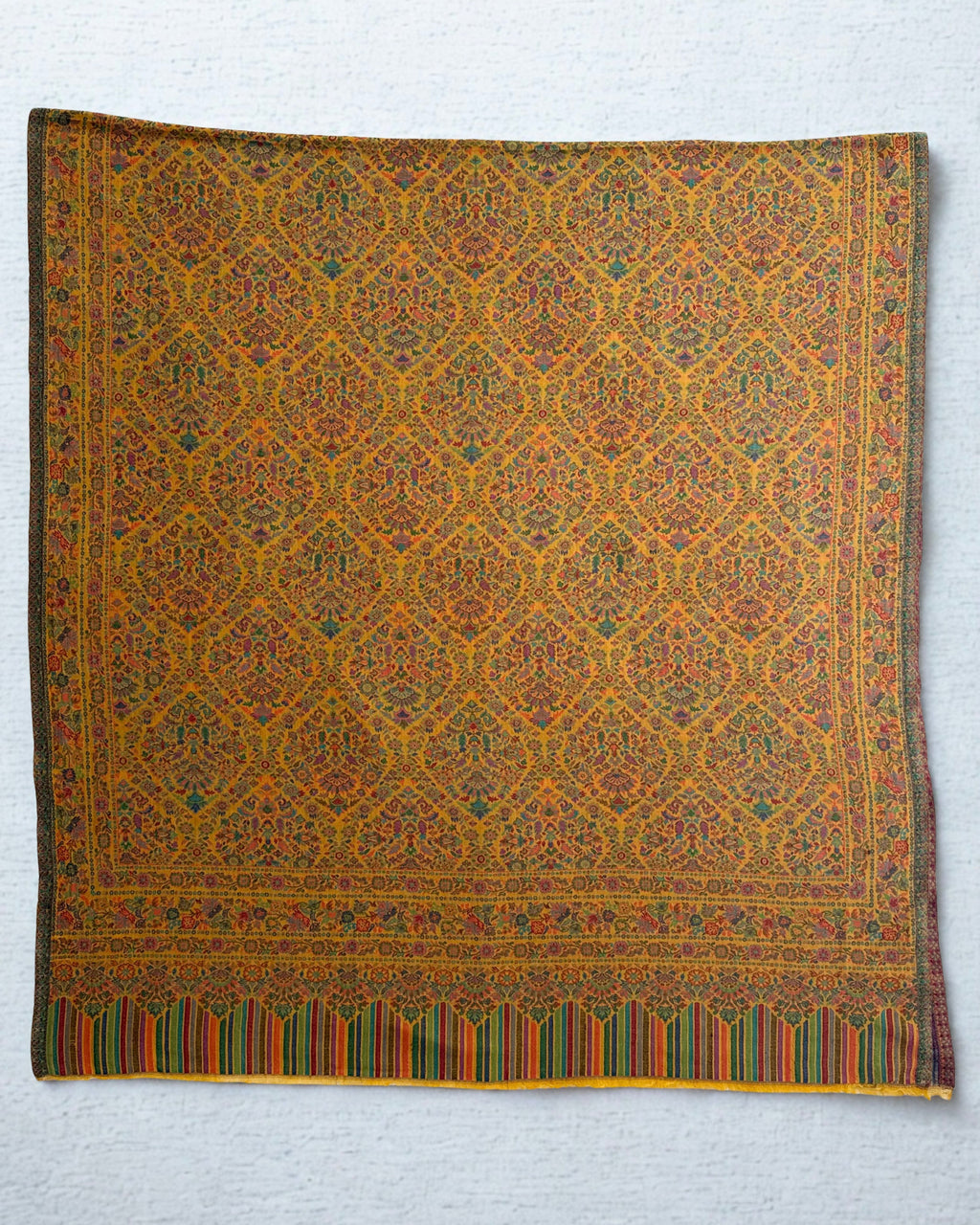 Marigold jamawar pashmina shawl swirled open, showing the drape and the density of the all-over floral weave