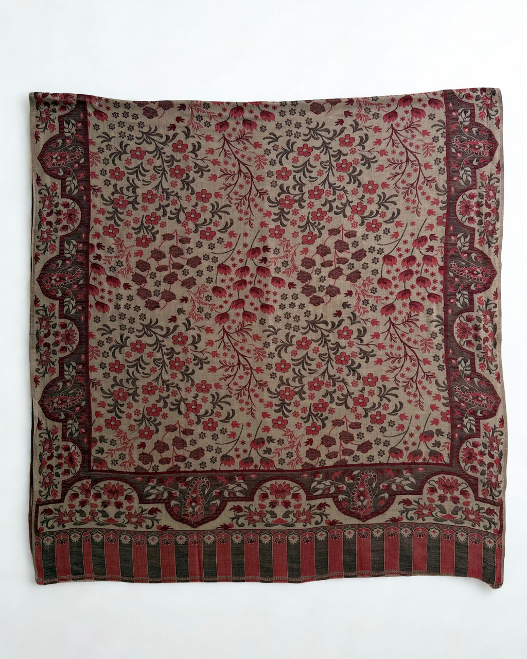 Detail of the striped colonnade end panel and paisley border on a taupe Kani pashmina shawl