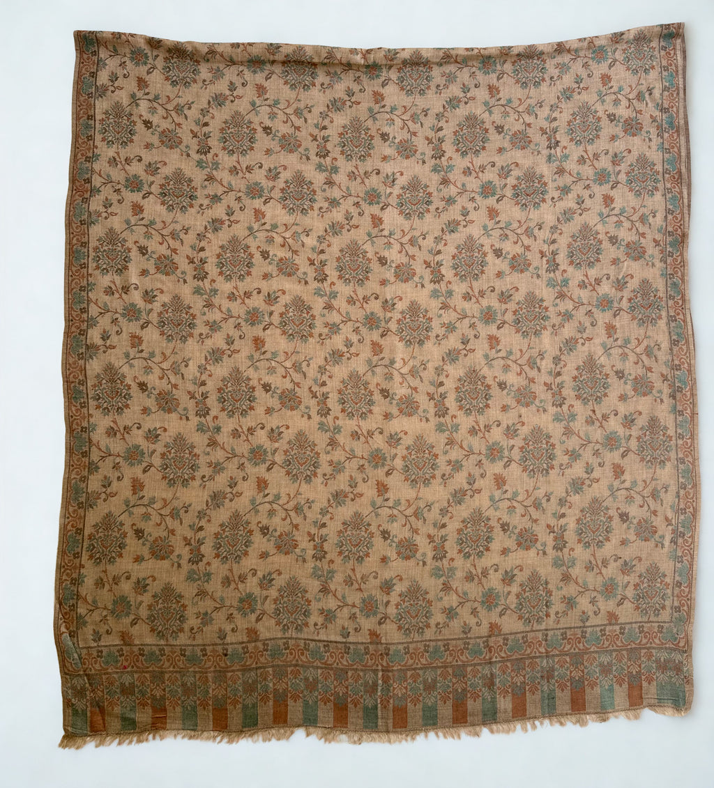 Camel and verdigris Kani pashmina shawl folded back to show the reverse of the vine weave and the striped fringed end panel