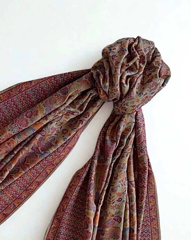 Antique rose Kani pashmina shawl knotted and fanned out, showing the drape and the multicoloured floral weave