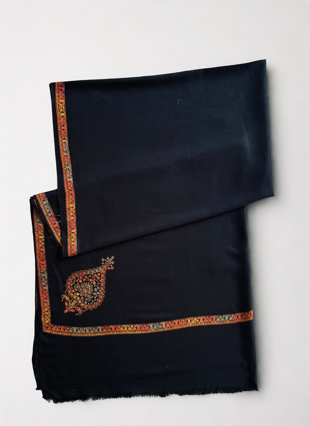 Close view of the large paisley buta filled with flowering vine and shaded in five colours