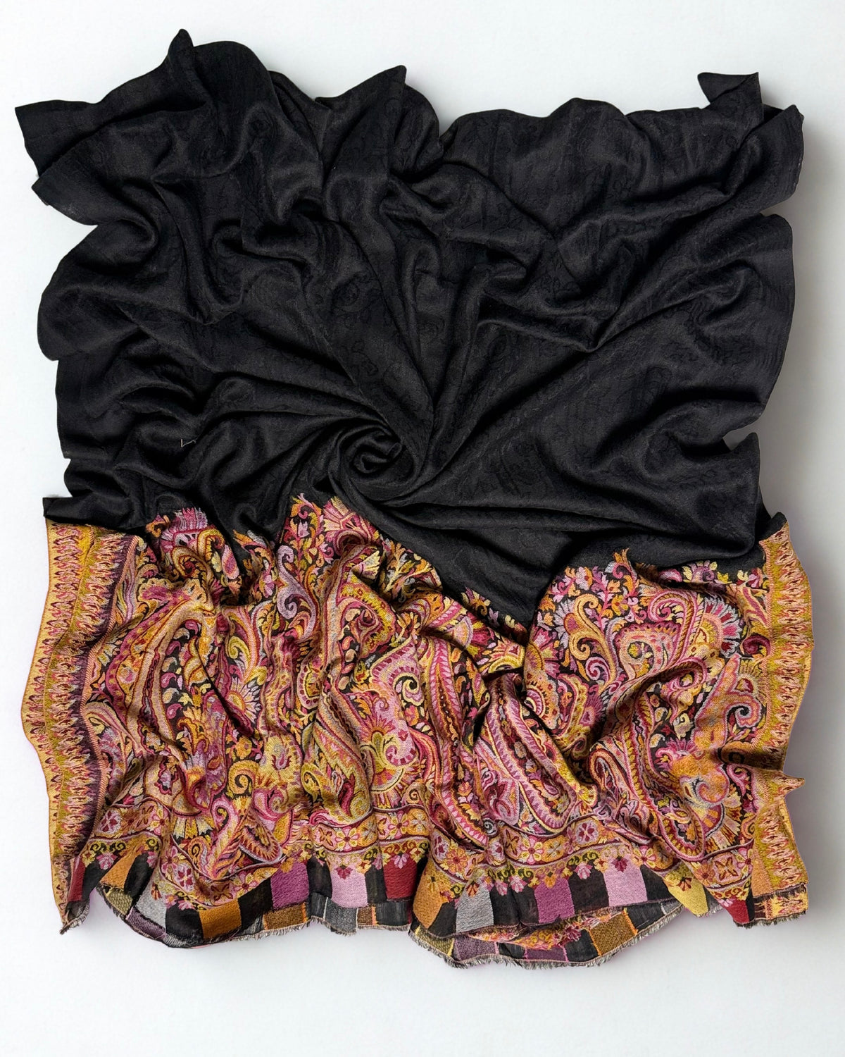 Detail of the self-coloured paisley woven through the black ground of an ek rukh Palladar shawl
