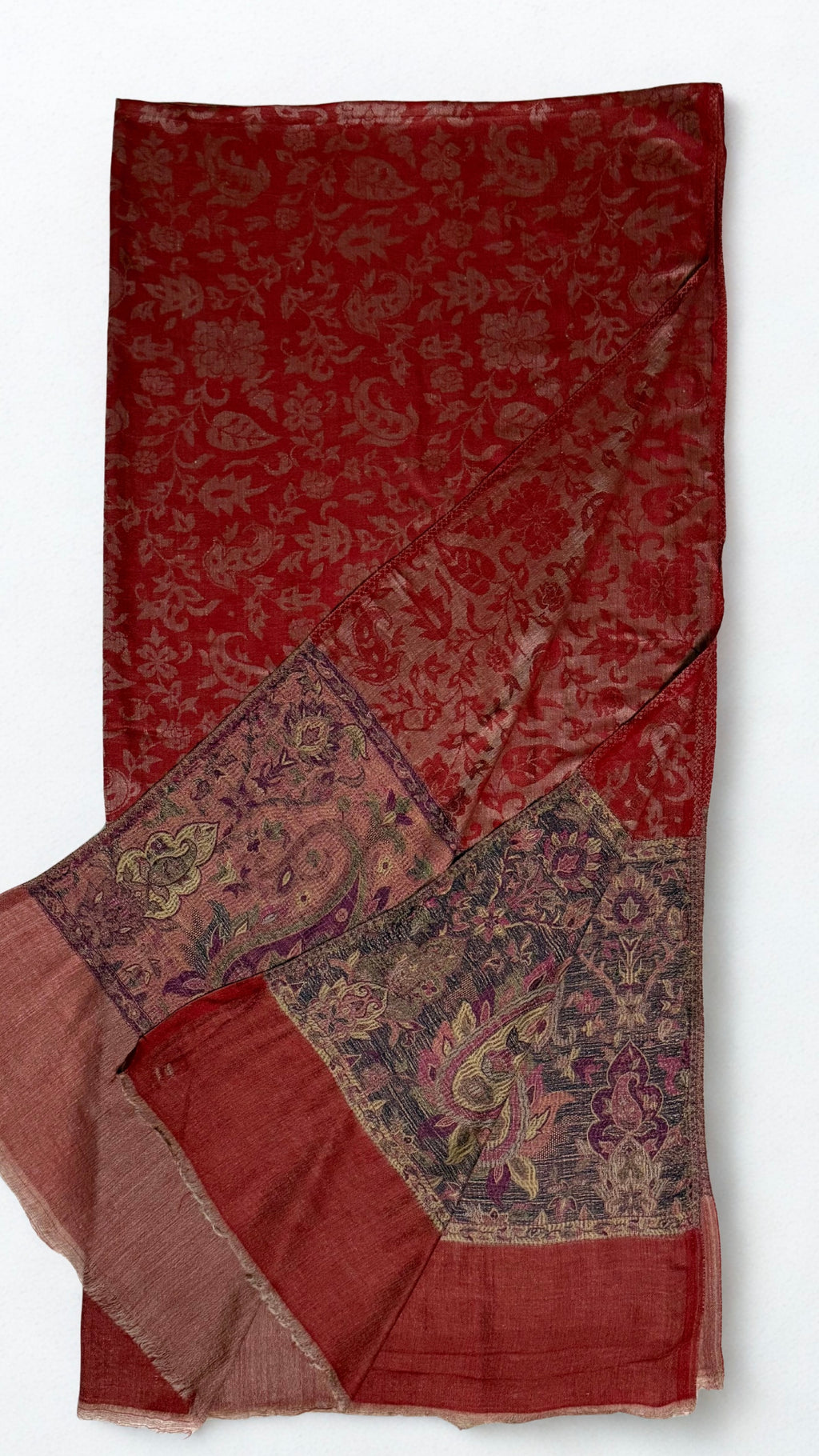 Scarlet Palladar shawl on a wooden hanger showing its full drape and both end borders