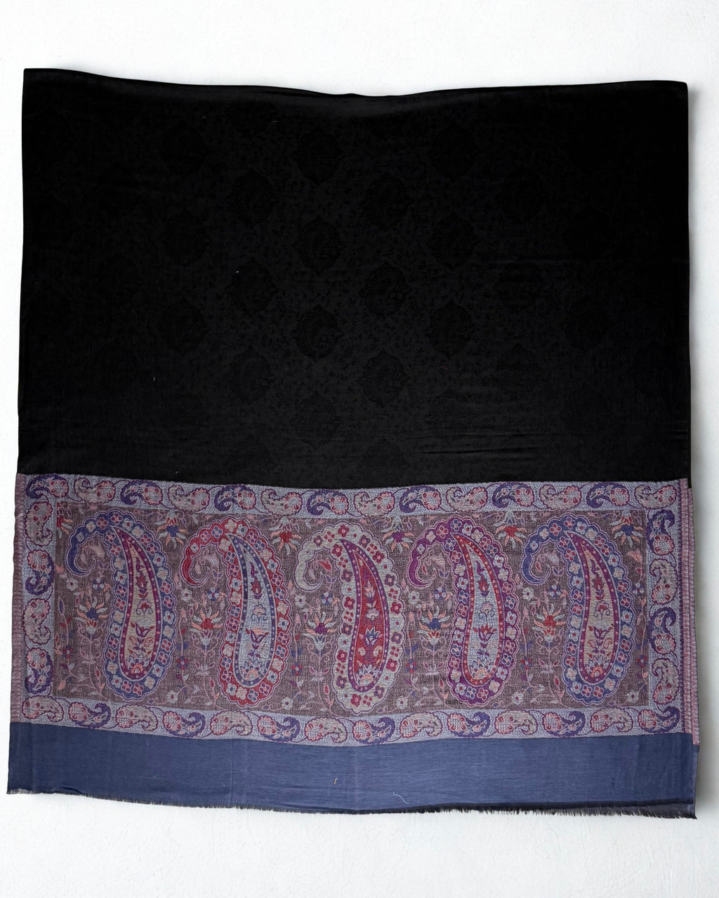 Both end panels of the black shawl side by side, borders matched