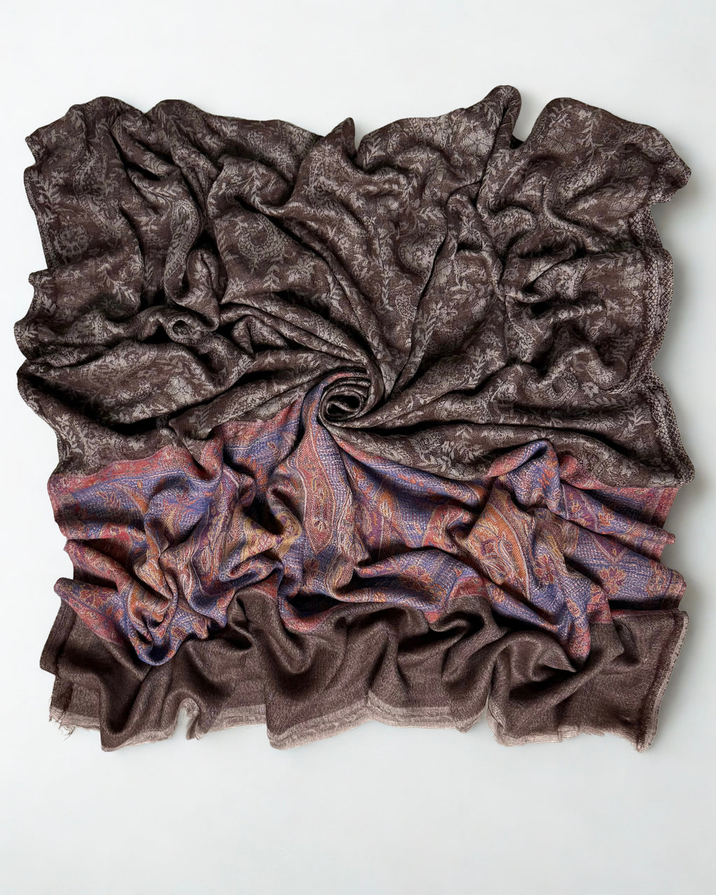 Full shawl laid flat, the paisley field reading as plain cocoa from a distance
