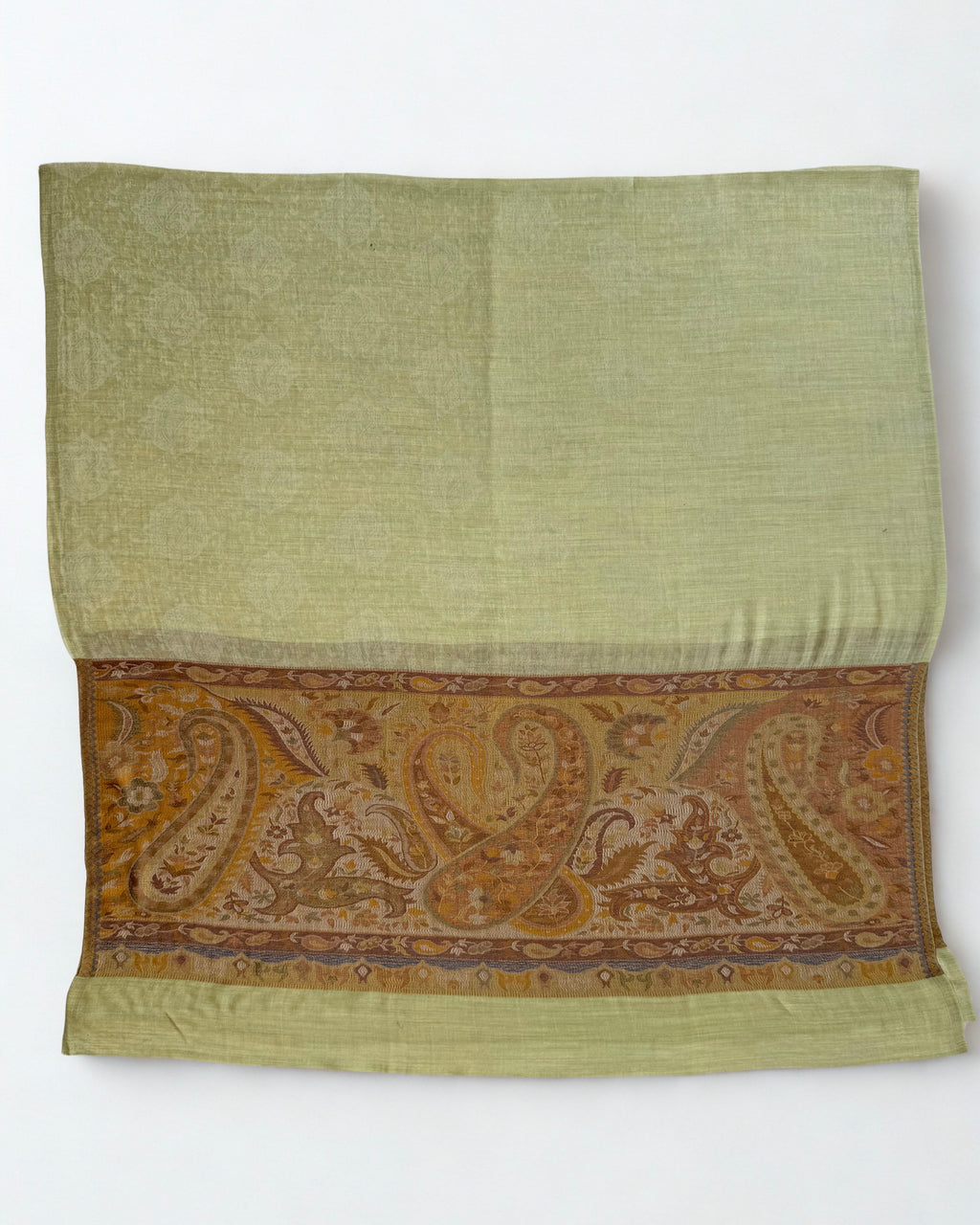 Pistachio Palladar shawl on a wooden hanger showing both amber borders
