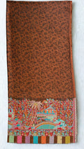 Rust fine pashmina ek rukh ring (Palladar) shawl with woven village landscape panel, on a wooden hanger