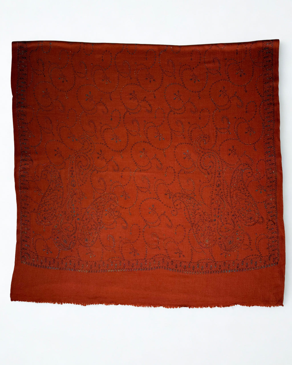 Rust Swati Shahtoosh shawl opened flat, paisley and vine embroidery covering the entire field