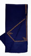 Navy Swati Shahtoosh shawl folded back to show the hand-embroidered antique gold border and corner paisleys