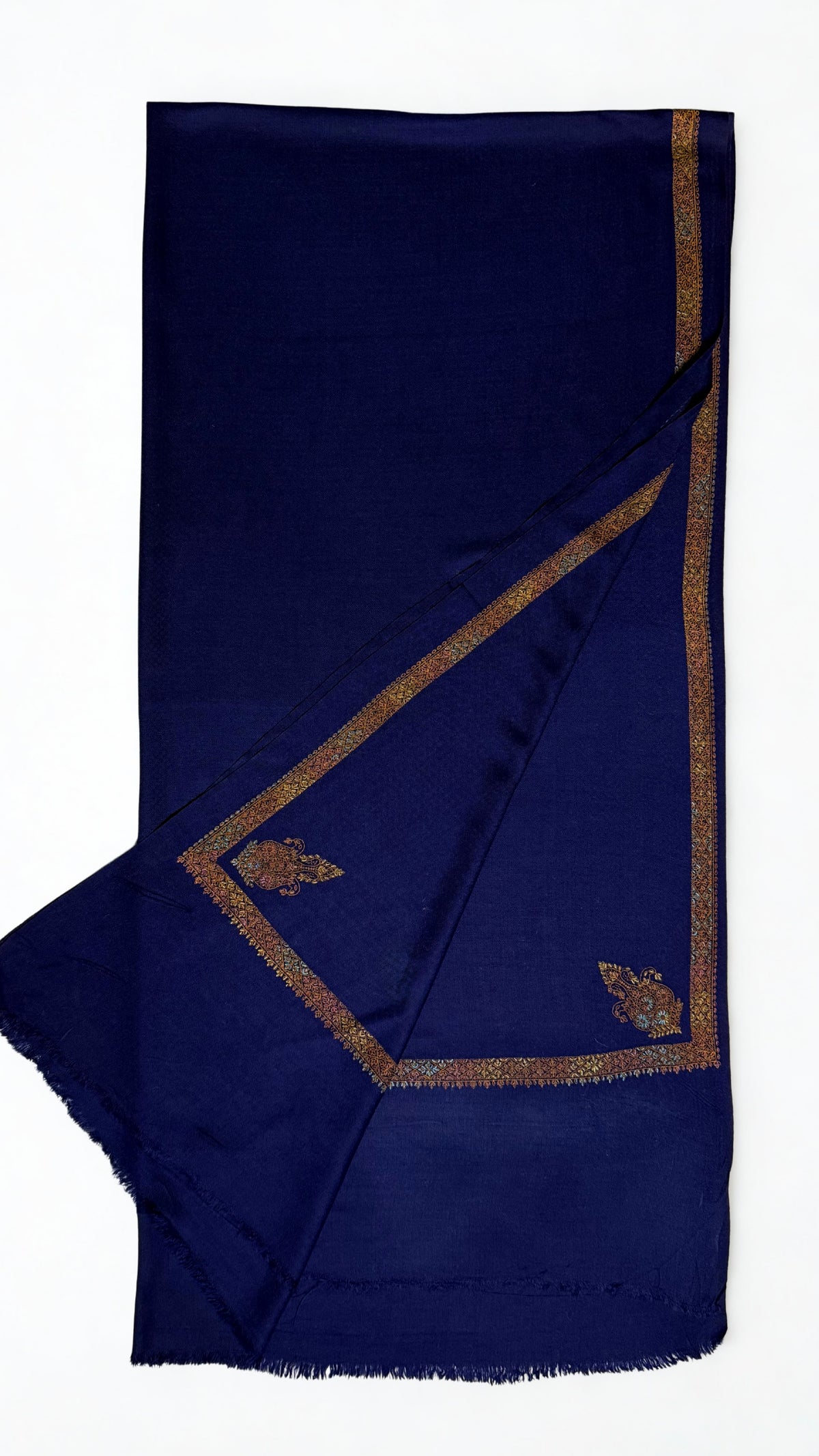 Navy Swati Shahtoosh shawl folded back to show the hand-embroidered antique gold border and corner paisleys