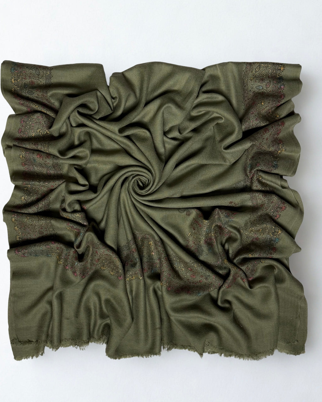 Olive green Swati Shahtoosh shawl swirled open, plain field with an embroidered border on all four sides