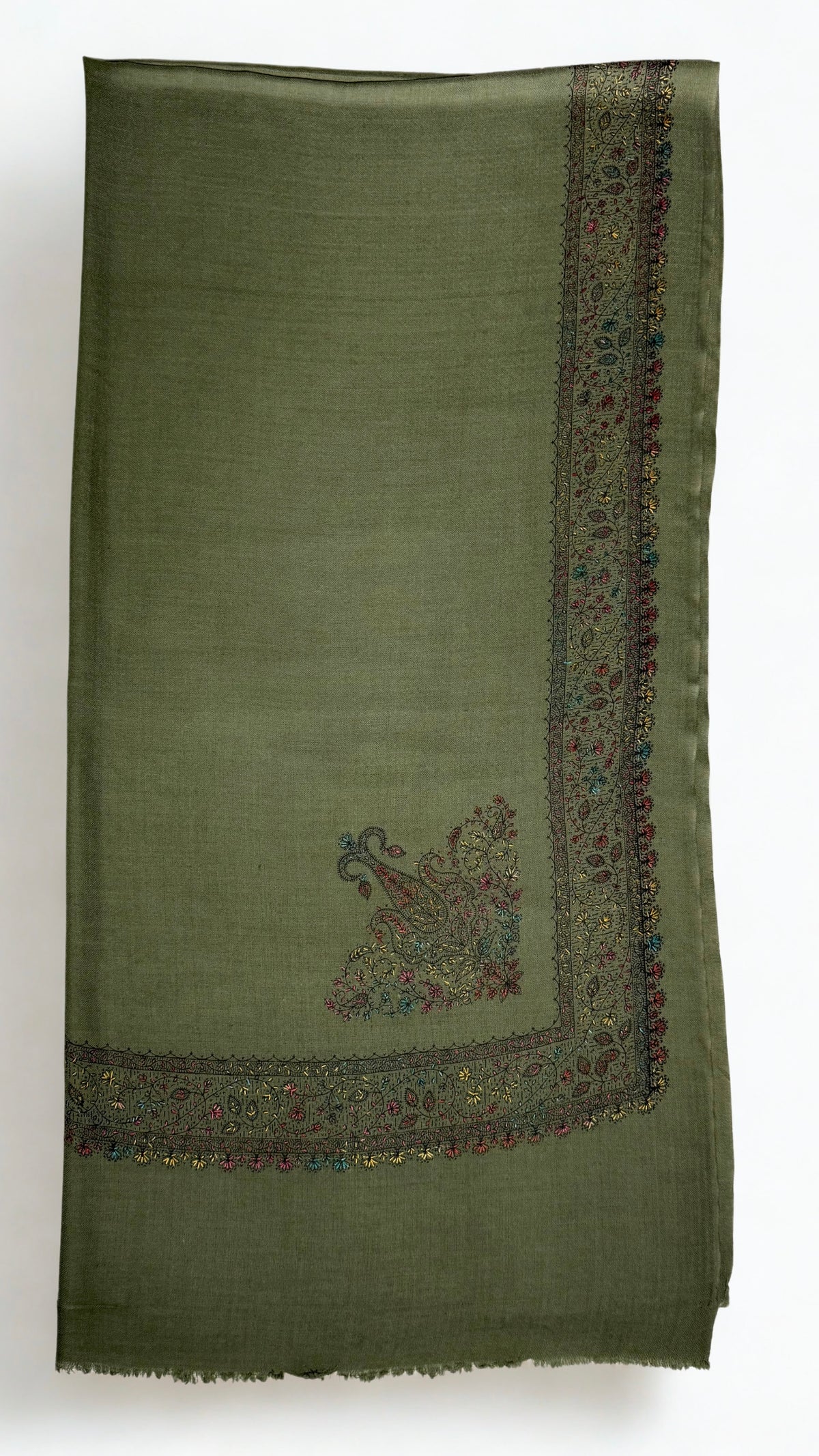 Olive green Swati Shahtoosh shawl folded flat, showing the corner paisley and hand-embroidered border