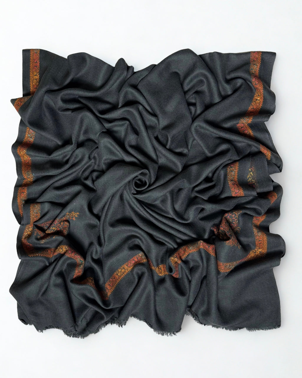 Charcoal Swati Shahtoosh shawl swirled open, plain field with a rust embroidered border on all four sides