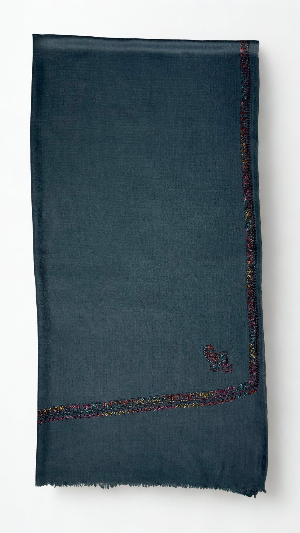 Slate grey Swati Shahtoosh shawl folded flat, corner paisley and fine hand-embroidered border