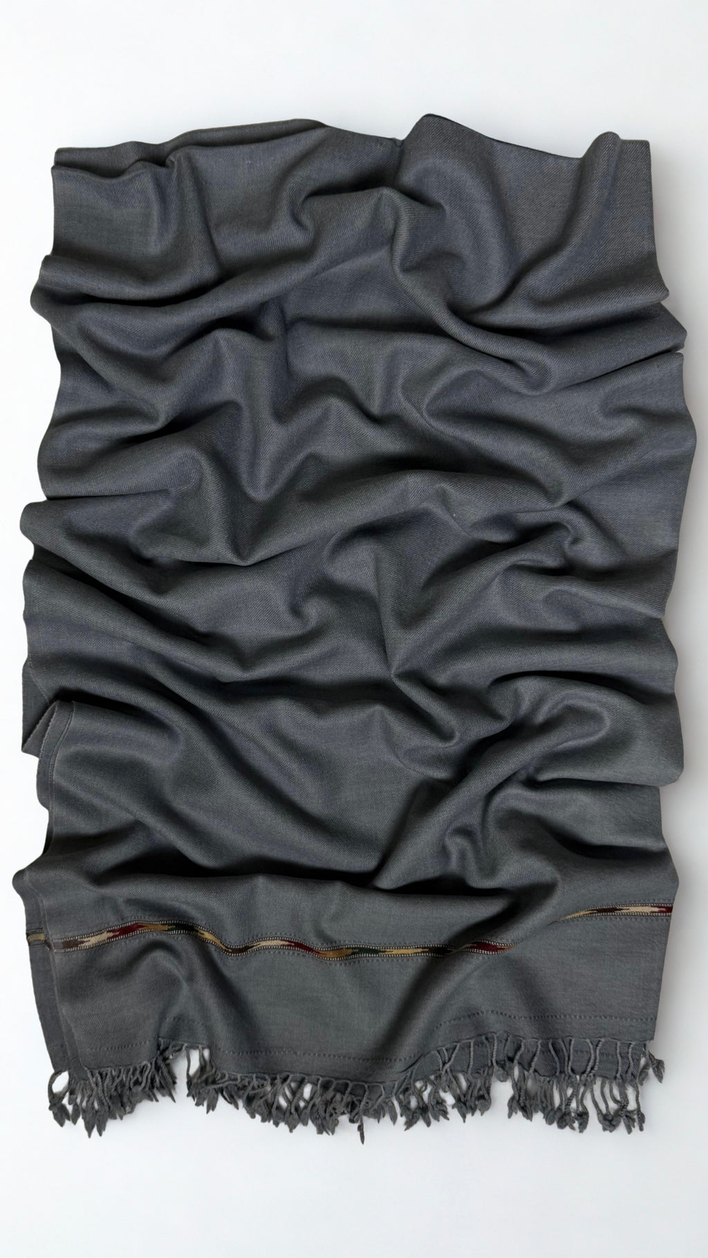Grey men's Swati pashmina shawl laid out full length, plain 64-count wool weave with a woven end band